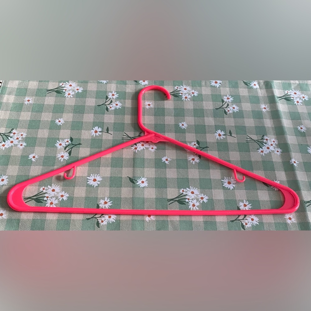 Bright Pink Plastic Clothing Hanger